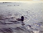 Seiko's Mother swimming in the ocean.\nJuly 1973, 71 Years Old